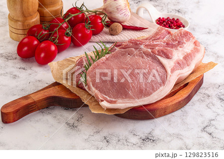 Raw potk loin steak with bone Raw potk loin steak with bone 129823516