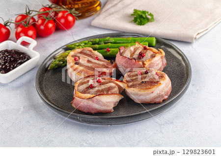 Tasty grilled pork medallion with bacon 129823601