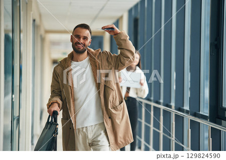 Couple are in the airport hall together 129824590