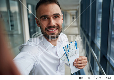Making selfie, happy facial expression. Young handsome man in the airport Making selfie, happy facial expression. Young handsome man in the airport 129824638