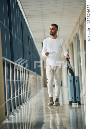 Young handsome man in the airport Young handsome man in the airport 129824672