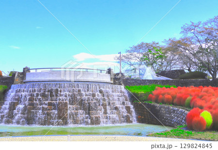 爽やかな青空と水辺の鮮やかな紅葉の箒草 129824845