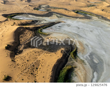 Aerial View of Desert Landscape with Sand Dunes and Salt Flats in Saudi Arabia Aerial View of Desert Landscape with Sand Dunes and Salt Flats in Saudi Arabia 129825476