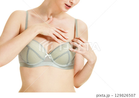 Attractive slim woman in grey matching underwear Attractive slim woman in grey matching underwear 129826507