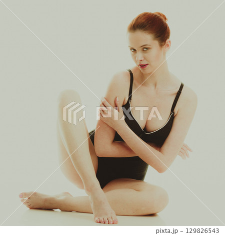 Attractive woman in black swimsuit style underwear 129826543