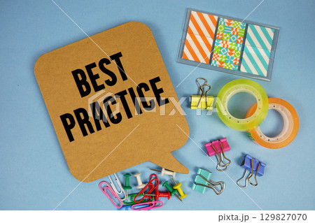 Best Practice text with stationery on blue background 129827070