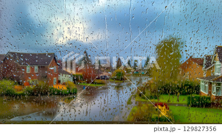 Cozy window view of rainy streets 129827356