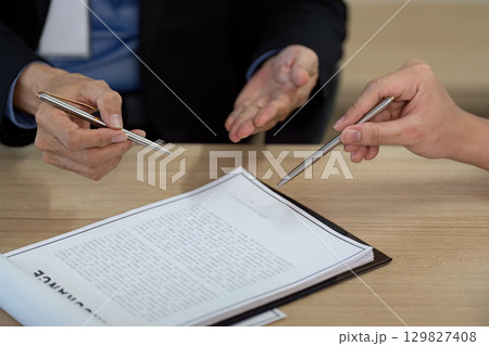 Engaging Discussion on Insurance Policy Between Agent and Client Engaging Discussion on Insurance Policy Between Agent and Client 129827408