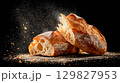 Freshly baked ciabatta on a dark background 129827953