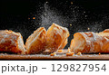 Freshly baked ciabatta bread on a dark background 129827954