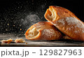 Freshly baked ciabatta bread on dark background 129827963