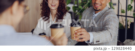 A coffee meeting with friends in a modern workspace can be relaxing and productive 129828440
