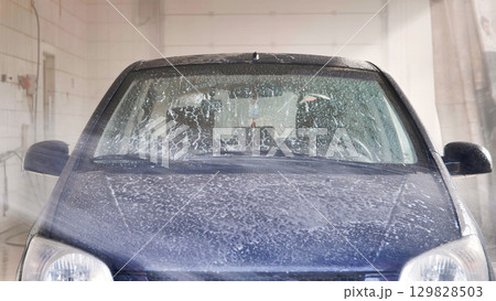 Car washing with soap and high pressure water jet 129828503