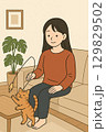 リビングで女性と猫があそぶ 129829502