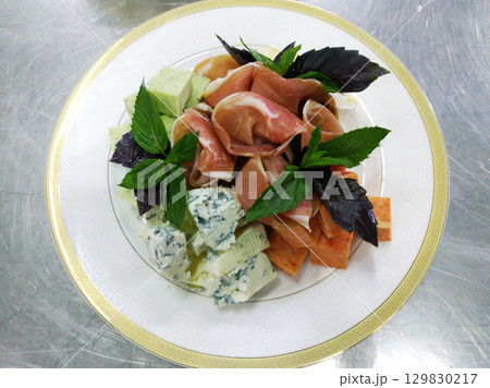 wine appetizer with different types of noble cheese and prosciutto wine appetizer with different types of noble cheese and prosciutto 129830217