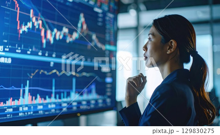 《AI画像》株価の上昇チャートを見る女性 《AI画像》株価の上昇チャートを見る女性 129830275