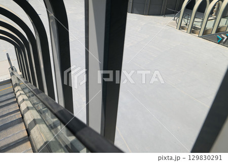 Modern Escalator and Architectural Arches in Boulevard, Riyadh. Modern Escalator and Architectural Arches in Boulevard, Riyadh. 129830291