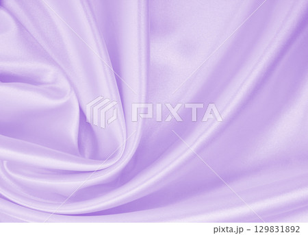 Smooth elegant lilac silk or satin texture as wedding background. Luxurious valentine day background design 129831892