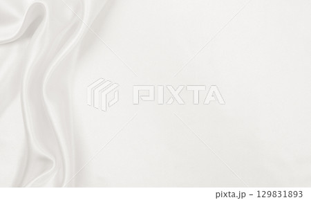 Smooth elegant golden silk or satin luxury cloth texture as wedding background. Luxurious Christmas background or New Year background design. In Sepia toned. Retro style Smooth elegant golden silk or satin luxury cloth texture as wedding background. Luxurious Christmas background or New Year background design. In Sepia toned. Retro style 129831893