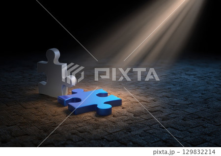 Illuminated Jigsaw Puzzle Pieces Fitting Together in Dramatic Dance of Light and Shadow 129832214