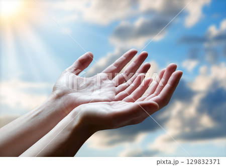 The outstretched hands of a praying man The outstretched hands of a praying man 129832371