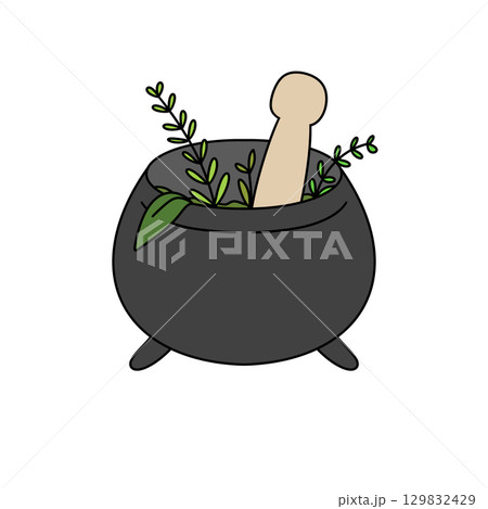 A black pot with a wooden spoon in it A black pot with a wooden spoon in it 129832429