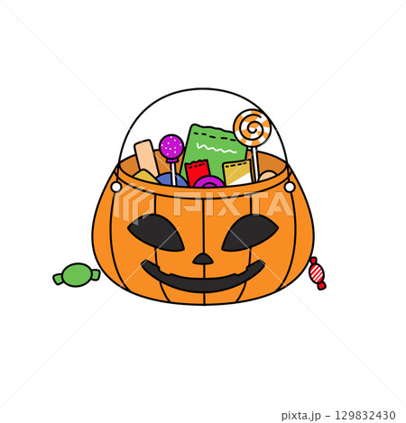 A Halloween basket filled with candy and other treats A Halloween basket filled with candy and other treats 129832430