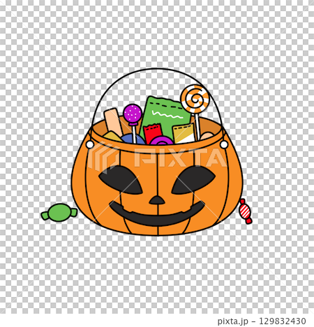 A Halloween basket filled with candy and other treats A Halloween basket filled with candy and other treats 129832430