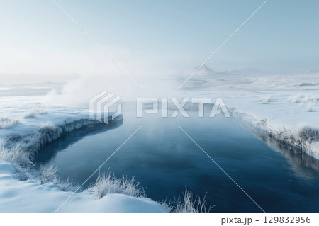 Relaxing in a geothermal hot spring surrounded by snowy mountains in Iceland 129832956