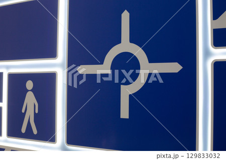 Educational panel with traffic signs, including pedestrian and directional symbols. Designed to teach road safety and traffic rules. Interactive display for learning road signs and traffic regulation 129833032
