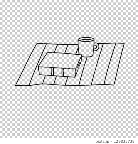 A book and a mug are on a table A book and a mug are on a table 129833739