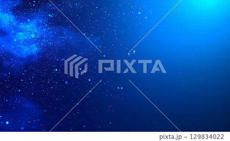 輝く粒子が舞い降りる幻想的なブルー背景 129834022