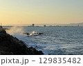 Sunset Waves Crashing Against Rocky Coastline in Nessebar, Bulgaria 129835482