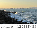 Sunset Waves Crashing Against Rocky Coastline in Nessebar, Bulgaria 129835483