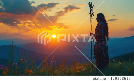 Silhouette of a Native American shaman with pikestaff on the backgroun. 129838615