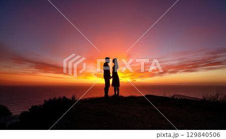 romantic silhouette of couple holding hands at sunset 129840506