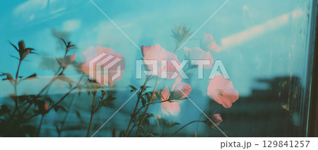 Floral elements blend with concrete textures, showcasing a harmony of nature and city life. 129841257