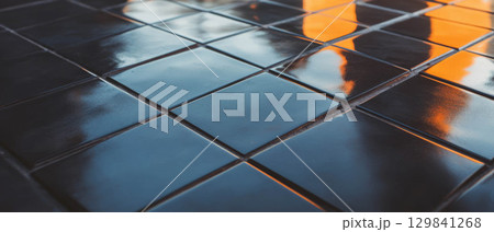 Black diamond tiles are arranged with contrasting grout, offering a striking graphic design look. Black diamond tiles are arranged with contrasting grout, offering a striking graphic design look. 129841268