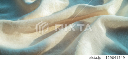 Soft and natural linen fabric texture providing a blank space for elegant designs and banners. 129841349