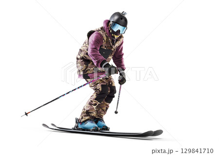 Skiing sport. Extreme sports. Skier in action. Sportsman in a ski suit. Driving at high speed. Sport. Side view. Isolated Skiing sport. Extreme sports. Skier in action. Sportsman in a ski suit. Driving at high speed. Sport. Side view. Isolated 129841710