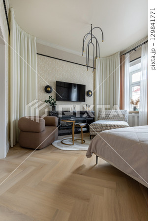 Modern Cozy Bedroom Interior with Fireplace 129841771