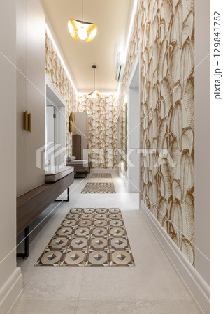Stylish Hallway with Leaf Patterned Wallpaper and Benches Stylish Hallway with Leaf Patterned Wallpaper and Benches 129841782