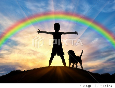 Silhouette of a happy child and dog 129843123