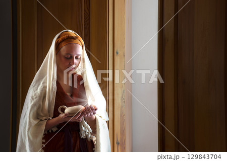 Young pretty girl with candle Young pretty girl with candle 129843704