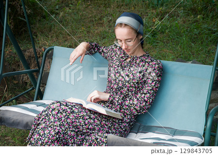 Pretty girl reading a book Pretty girl reading a book 129843705
