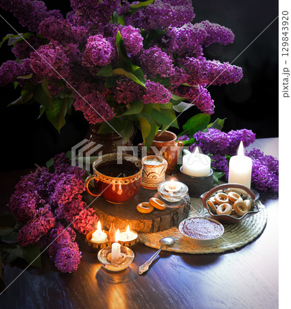 Still life from food and lush lilac boquet 129843920
