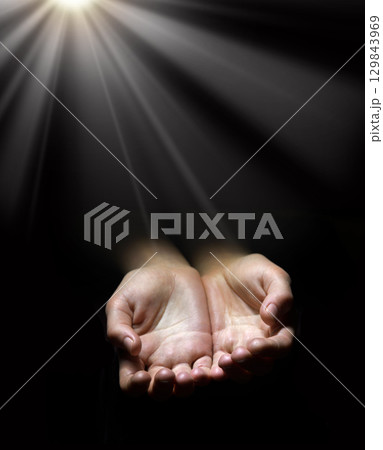 Asking hands on black backdrop Asking hands on black backdrop 129843969