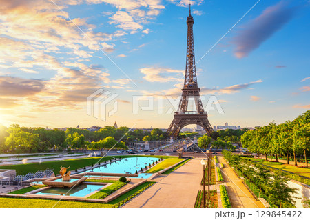 Paris landmark Eiffel Tower, view from Trocadero fountain, sunset light 129845422