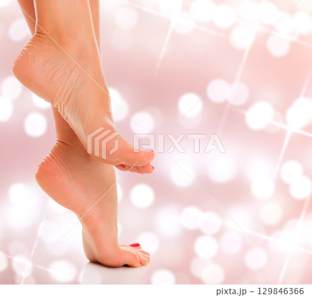 Woman feet closeup on an abstract background 129846366