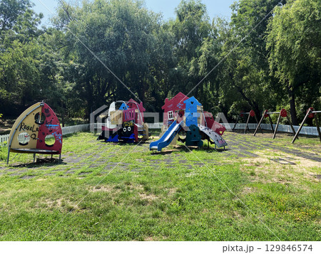 Broken swings on a playground in Bucharest, Romania Broken swings on a playground in Bucharest, Romania 129846574